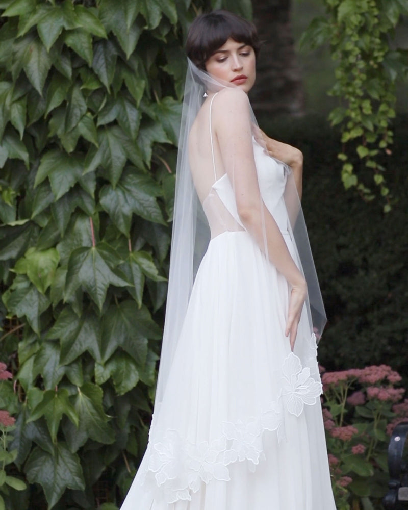 Side view of the Hibiscus Floral Lace Veil in waltz length.