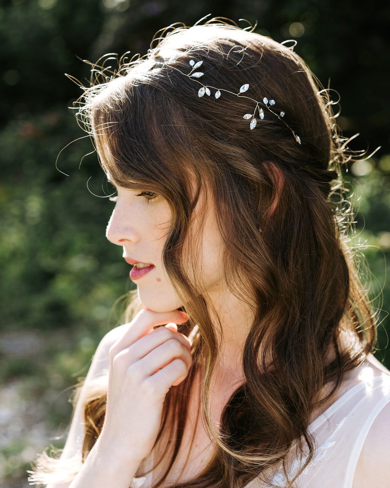 A bride wears the Sparkling crystal hair vine in gold.