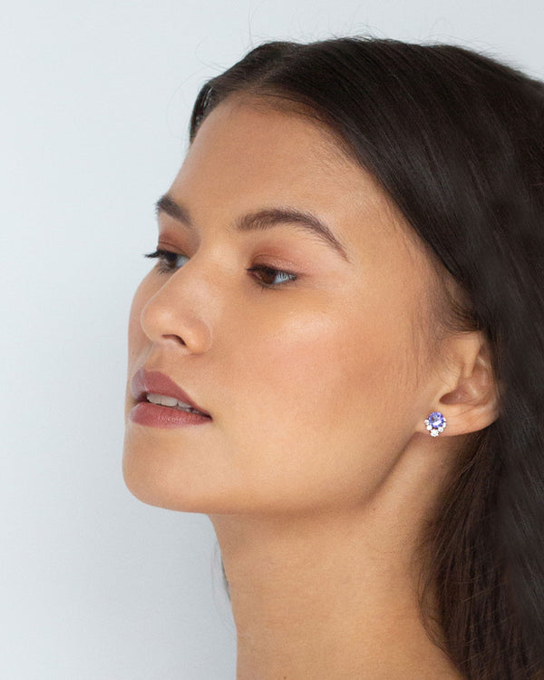 A model wears the Celestial Crystal Cluster Earrings in rose gold/tanzanite in the petite 6mm size.