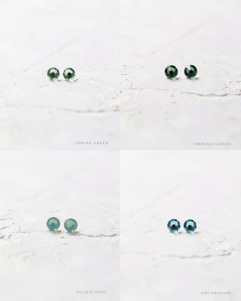 Close product view of the Starry Eyed Stud Bridesmaid earrings in spring green, emerald green, pacific opal, and aquamarine.