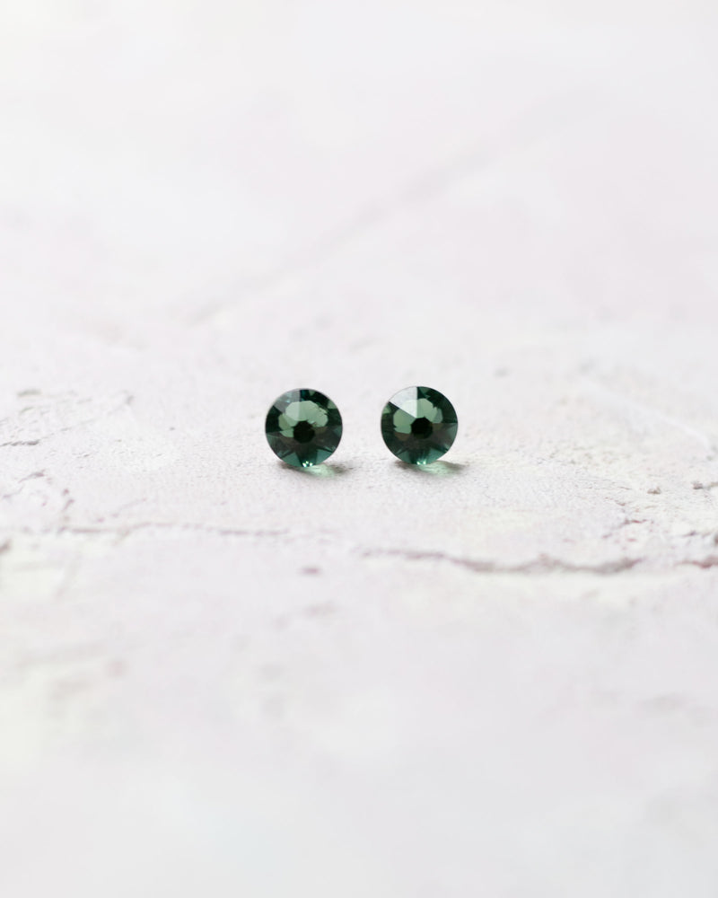Close product view of the Starry Eyed Bridesmaid Earrings in emerald green.