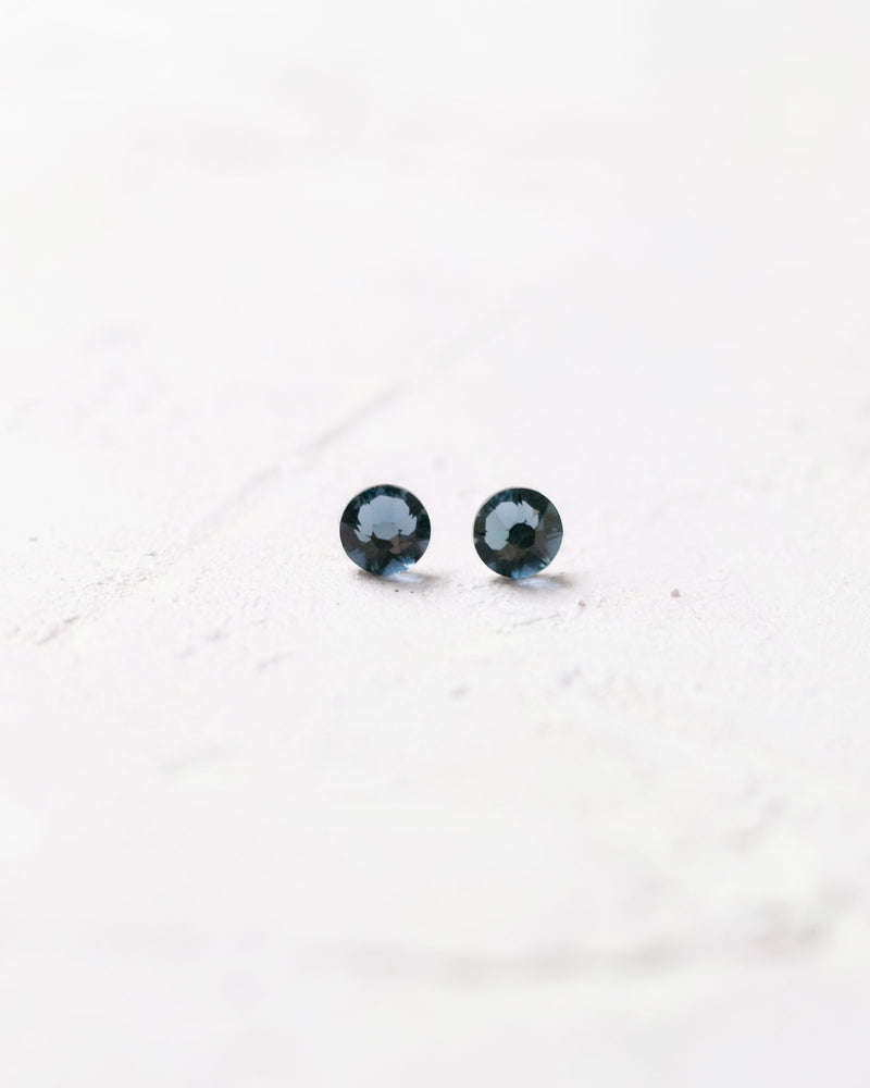 Close product view of the Starry Eyed Stud Earrings in lake blue crystal.