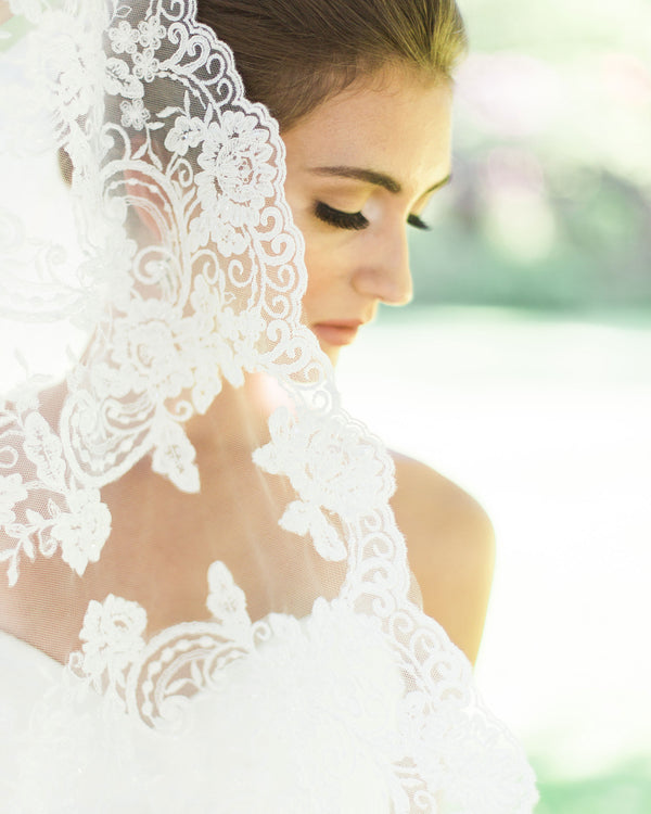 Model wearing Whispering Roses Beaded Lace Chapel wedding Veil