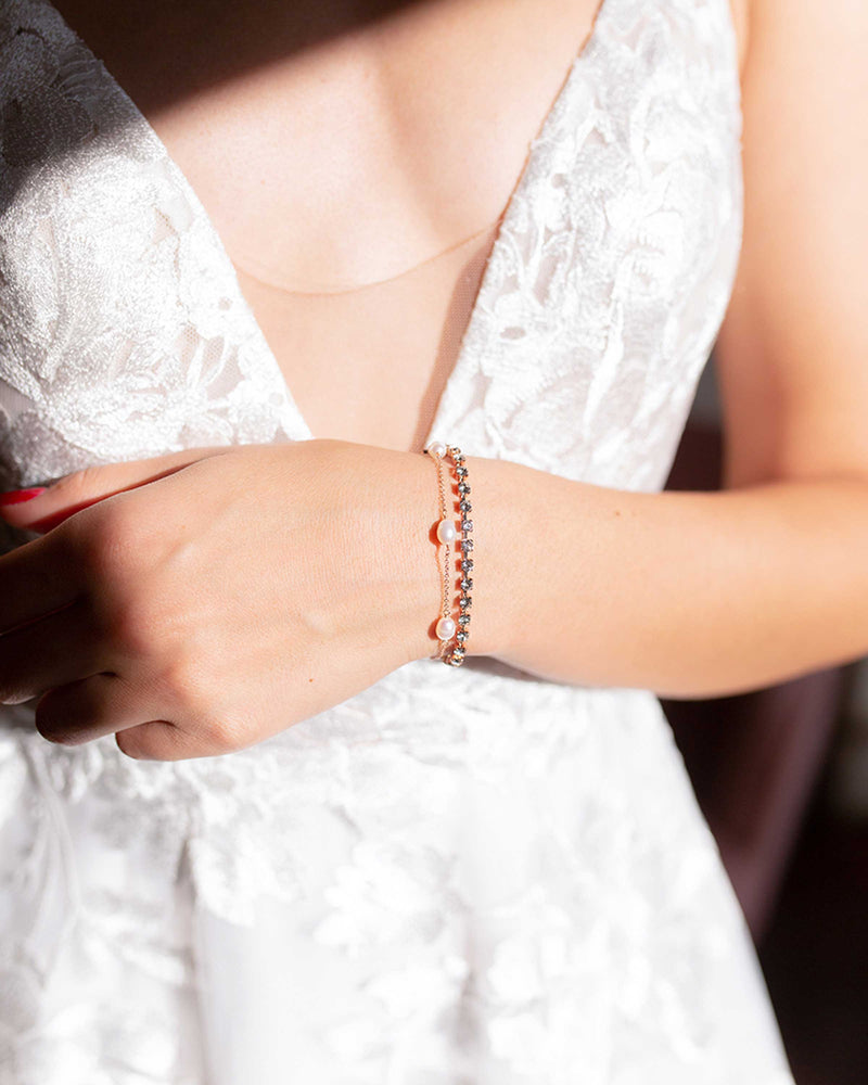 Close model view of a bride wearing the Astra Double Strand Bracelet in rose gold.