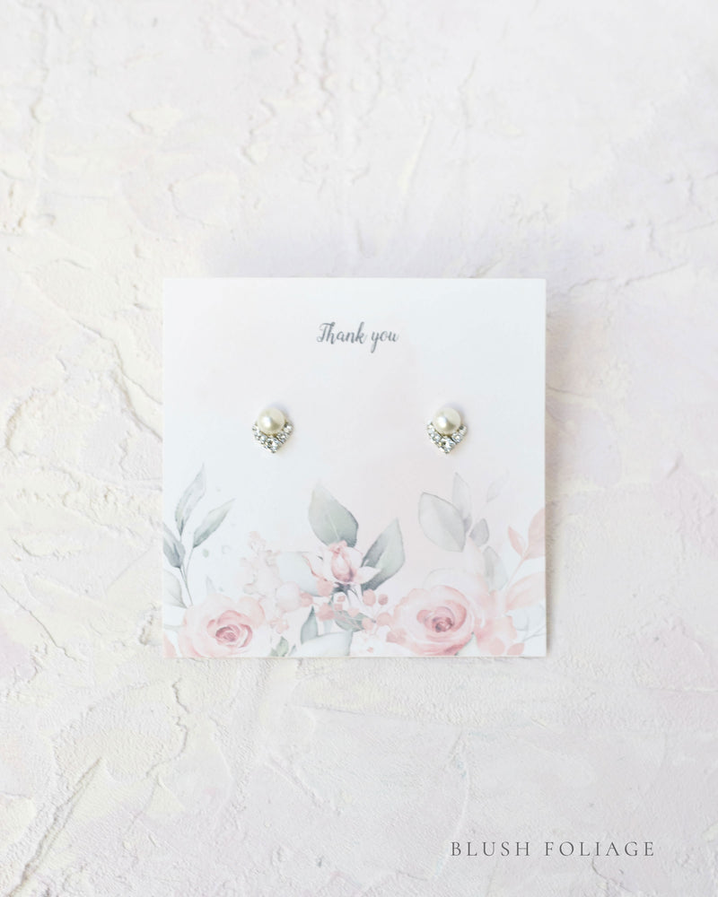 Flatlay of a custom jewelry insert option for our Luxe Gift Wrapping; blush foliage.