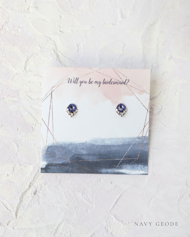 Flatlay of a custom jewelry insert option for our Luxe Gift Wrapping; navy geode.