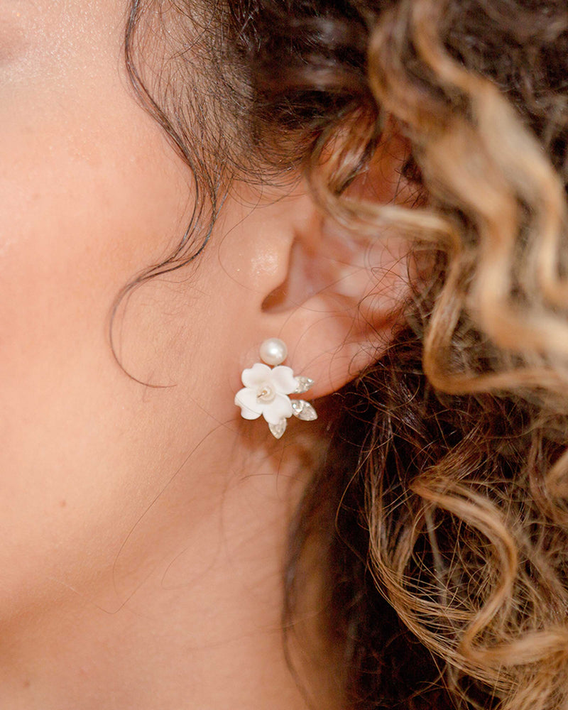Close model view of the Belle Fleur Earrings with silver and ivory flowers.