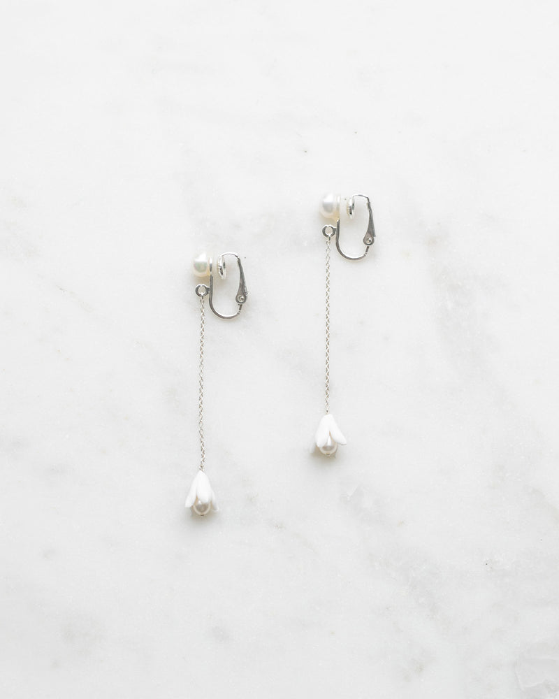 Close view of the Belle Fleur Long Earrings in silver with ivory flowers and clip-on.