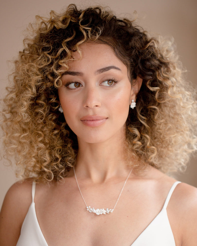 A model wears the Belle Fleur Necklace with the Belle Fleur Cluster Earrings.