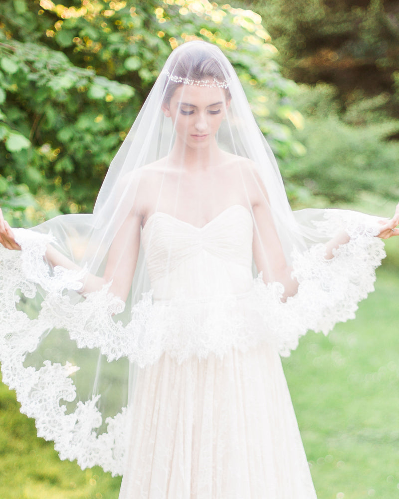 Model wears cassia short wedding veil with blusher