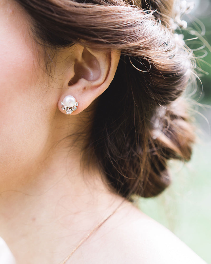 Close model view of the Celestial Pearl Cluster Earrings in gold with natural freshwater pearls.