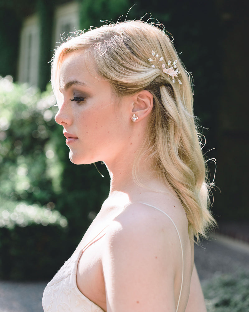 A bride wears the Celestial Stud Earrings in gold with blush freshwater pearls.
