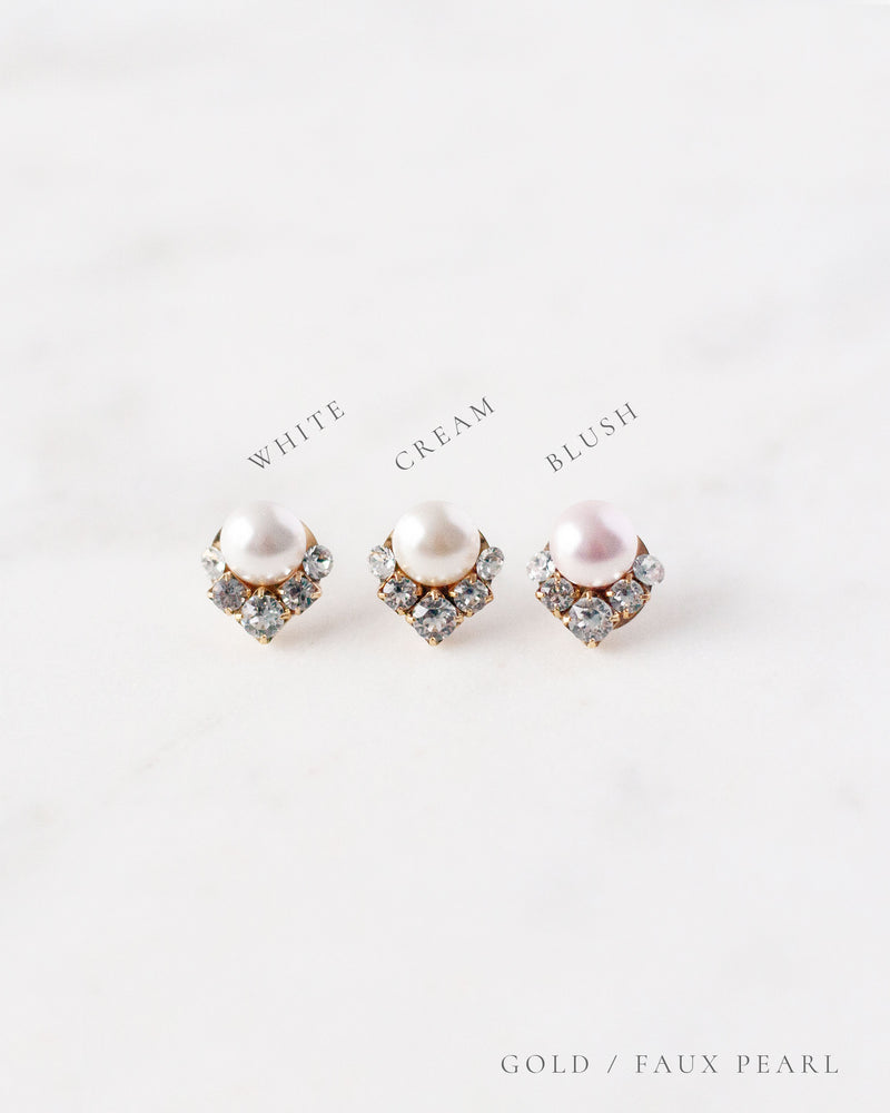 A side by side view of the faux pearl color options, all shown with gold settings.