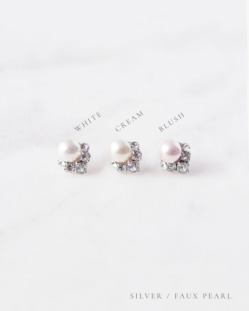 A side by side view of the faux pearl color options, all shown with silver settings.