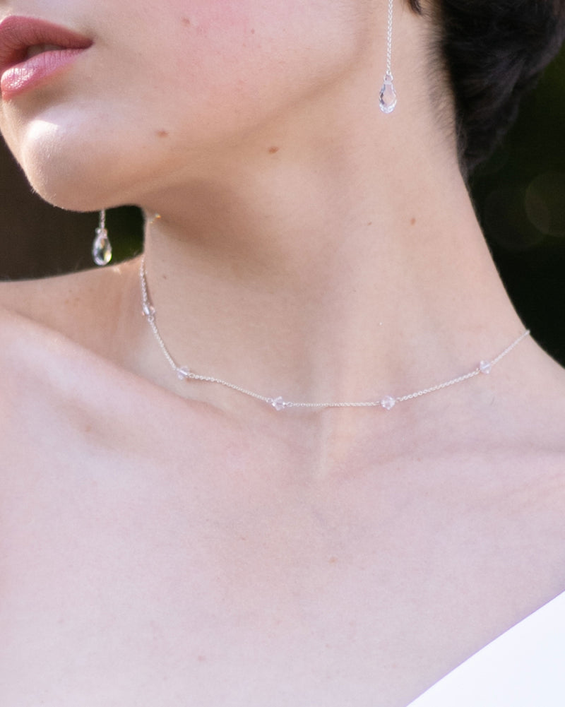 Close model veil of the Dainty Crystal Necklace in silver.
