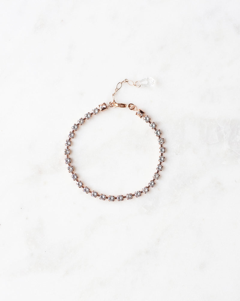 Flatlay of the Delicate Tennis Bracelet in rose gold.