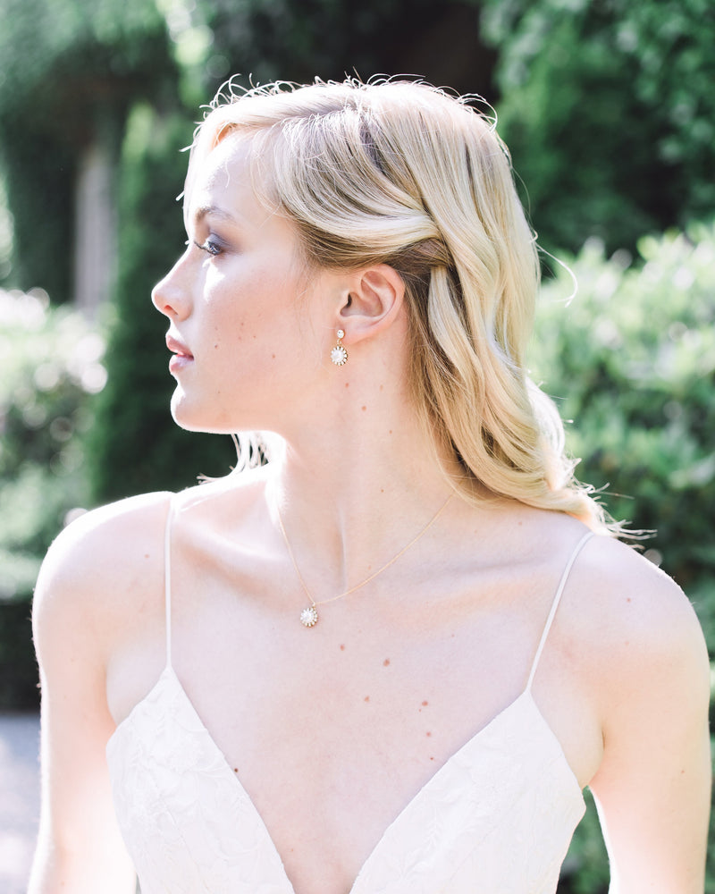 Model wearing the Halo Pearl Drop Necklace styled with the matching Halo Pearl Drop Earrings.