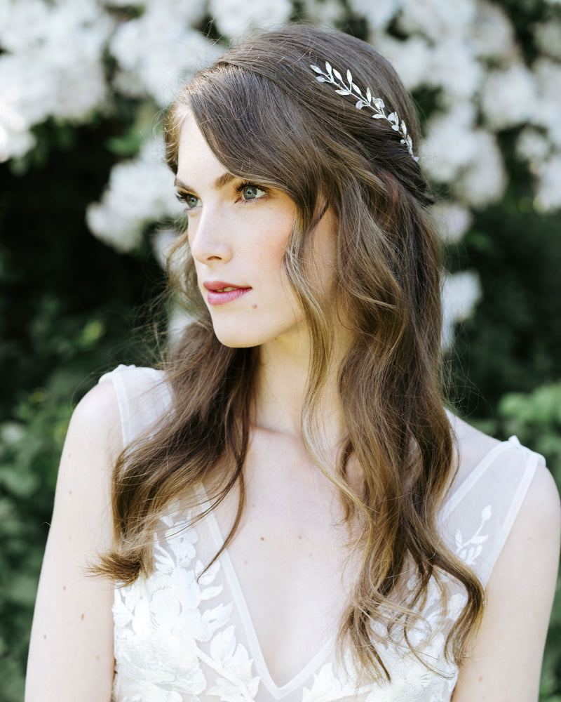 A bride wears the Sea Mist Comb, with scattered crystals and rose quartz gemstones..