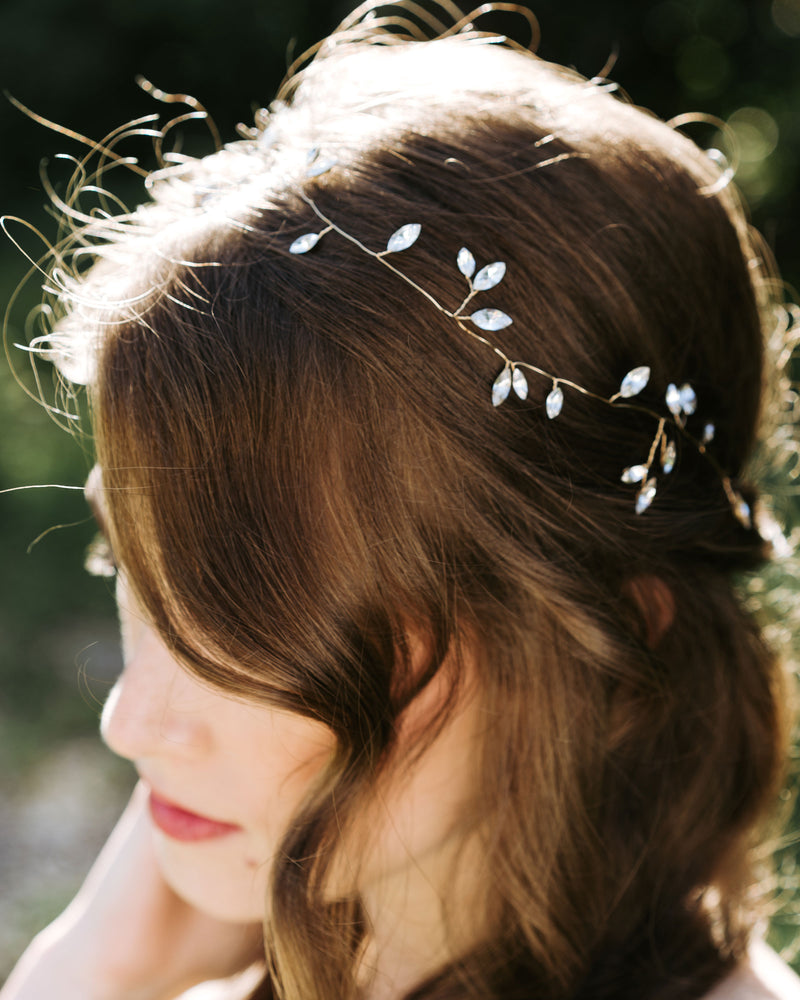 Model wearing Sparkling crystal bridal hair vine in gold.